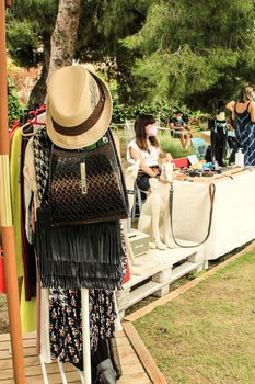Elche, Alicante, Spain- June 20, 2021: Secondhand clothing and accessories for sale at a market stall in Elche, Alicante, Spain