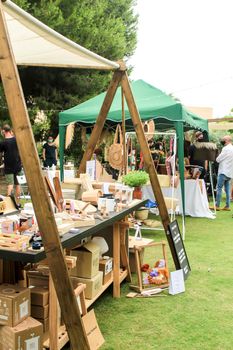 Elche, Alicante, Spain- June 20, 2021: Ecological, secondhand and sustainable market held in a rural setting in the countryside of Elche