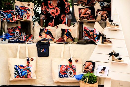 Elche, Alicante, Spain- June 20, 2021: Handicrafts products for sale at an ecological and sustainable market in Elche, Alicante, Spain