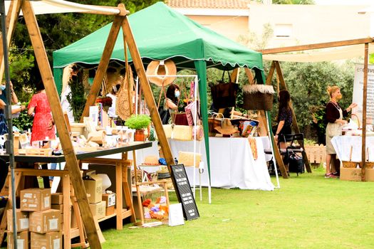 Elche, Alicante, Spain- June 20, 2021: Ecological, secondhand and sustainable market held in a rural setting in the countryside of Elche