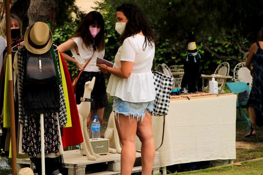 Elche, Alicante, Spain- June 20, 2021: Ecological, secondhand and sustainable market held in a rural setting in the countryside of Elche