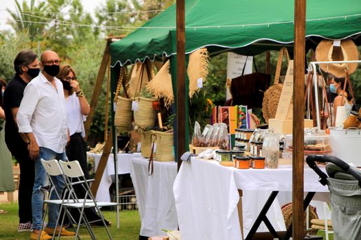 Elche, Alicante, Spain- June 20, 2021: Ecological, secondhand and sustainable market held in a rural setting in the countryside of Elche