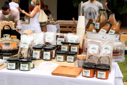 Elche, Alicante, Spain- June 20, 2021: Fresh products for sale at an ecological and sustainable market in the countryside of Elche