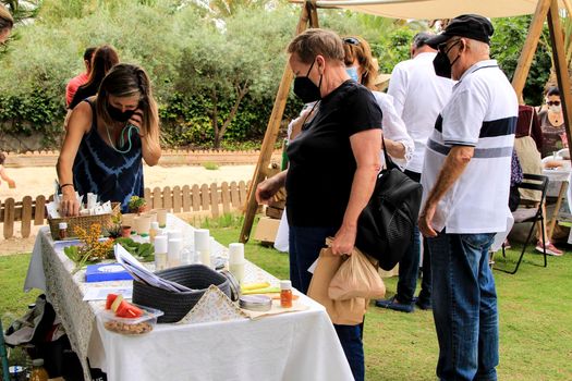 Elche, Alicante, Spain- June 20, 2021: Ecological, secondhand and sustainable market held in a rural setting in the countryside of Elche