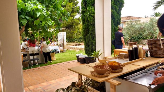 Elche, Alicante, Spain- June 20, 2021: Ecological, secondhand and sustainable market held in a rural setting in the countryside of Elche