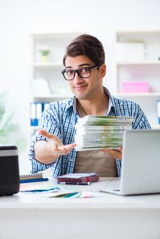 Sales assistant at publishing house showing ready printed books