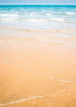 Light reflection on the surface of sea on sand beach