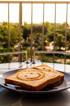 Breakfast with morning light at the balcony