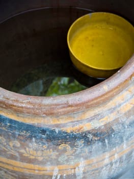 Yellow plastic bowl float in the Jar