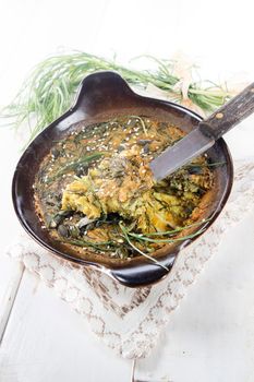 Vegan omelette cuisine made with natural ingredients such as chickpea flour and agretti 