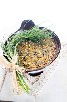 Vegan omelette cuisine made with natural ingredients such as chickpea flour and agretti 