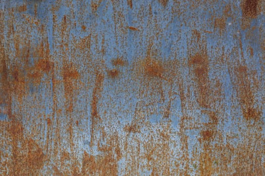 rusted flat solid sheet metal background and texture with leftovers of light-blue paint