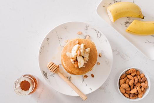 banana cashew pancakes with bananas and salted caramel sauce. the toning. selective focus