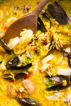 Presentation of a dish of Spain, paella being cooked