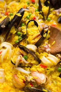 Presentation of a dish of Spain, paella being cooked