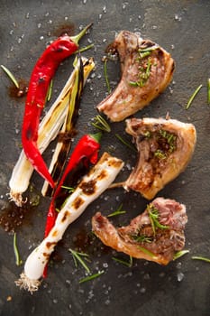 Lamb chops cooked on the grill with leek and red pepper