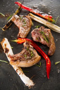 Lamb chops cooked on the grill with leek and red pepper