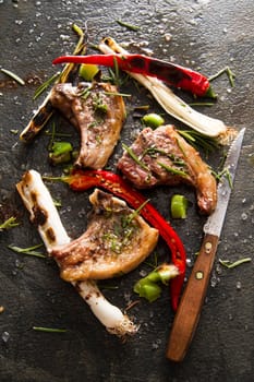 Lamb chops cooked on the grill with leek and red pepper