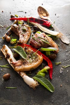 Lamb chops cooked on the grill with leek and red pepper