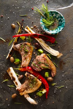 Lamb chops cooked on the grill with leek and red pepper