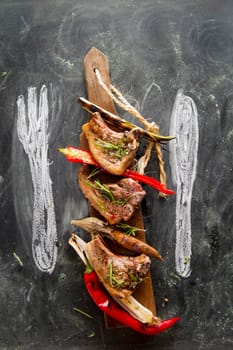 Lamb chops cooked on the grill with leek and red pepper