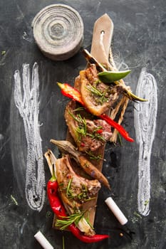 Lamb chops cooked on the grill with leek and red pepper