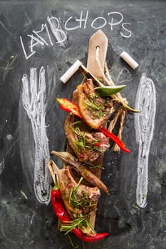 Lamb chops cooked on the grill with leek and red pepper