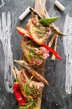 Lamb chops cooked on the grill with leek and red pepper