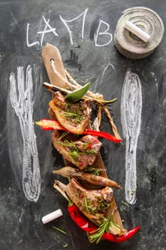 Lamb chops cooked on the grill with leek and red pepper