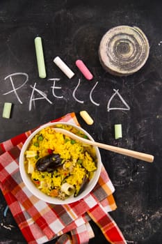 Spanish dish made of rice and fish with various vegetables