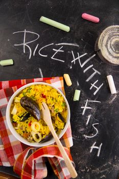 Spanish dish made of rice and fish with various vegetables