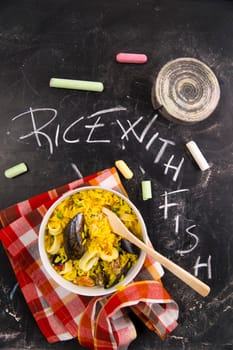 Spanish dish made of rice and fish with various vegetables