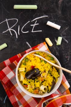 Spanish dish made of rice and fish with various vegetables