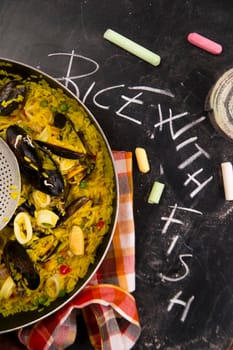 Spanish dish made of rice and fish with various vegetables