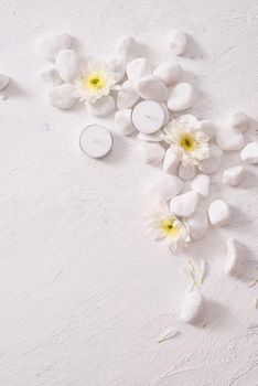 Spa setting with white flower ,candle on stone table