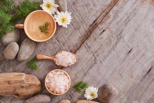 body care camomile cosmetic products on wooden desk background