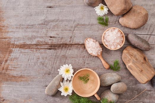 body care camomile cosmetic products on wooden desk background