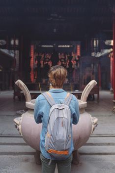 Traveler at Thien Hau Pagoda, dedicated to the Chinese sea goddess Mazu , in Cholon, the Chinatown area of Saigon