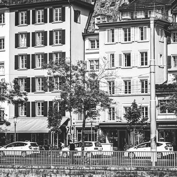 Zurich, Switzerland circa June 2021: Vintage monochrome view of historic Old Town streets and buildings near main train station Zurich HB, Hauptbahnhof, Swiss architecture and travel destination