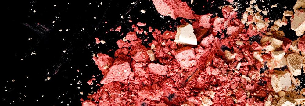 Crushed cosmetics, mineral organic eyeshadow, blush and cosmetic powder isolated on black background, makeup and beauty banner, flatlay design.