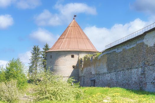 View of the old stone fortress with a watchtower. Fortress Oreshek on a sunny summer day