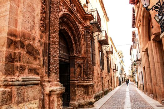 Narrow streets with Renaissance style houses and carved facades in Alcaraz, Castile-la Mancha community, Spain