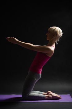 Woman exercising pilates.