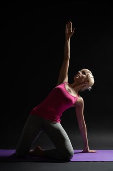 Woman exercising pilates. Mermaid exercise.