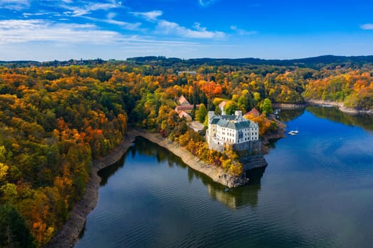 Aerial view chateau Orlik, above Orlik reservoir in beautiful autumn nature. Romantic royal Schwarzenberg castle above water level. Czechia. Orlik castle across the River Vltava, Czech Republic.