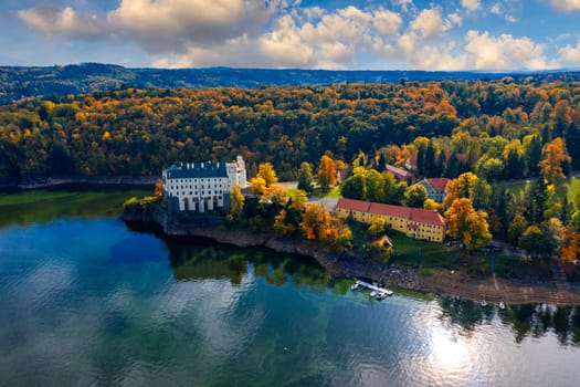 Aerial view chateau Orlik, above Orlik reservoir in beautiful autumn nature. Romantic royal Schwarzenberg castle above water level. Czechia. Orlik castle across the River Vltava, Czech Republic.