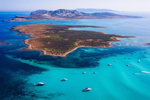View from above, stunning aerial view of the Isola Piana island and the Asinara island bathed by a beautiful turquoise clear water. Stintino, Sardinia, Italy.