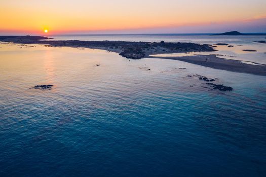 Aerial drone shot of beautiful turquoise beach with pink sand Elafonissi, Crete, Greece. Best beaches of Mediterranean, Elafonissi beach, Crete, Greece. Famous Elafonisi beach on Greece island, Crete.