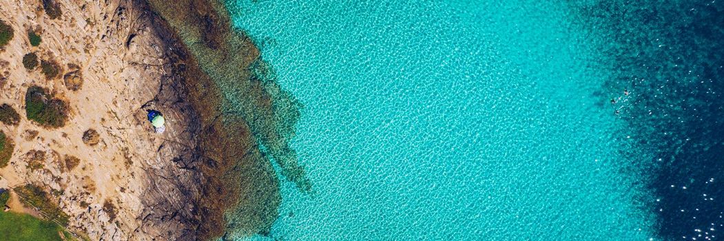 Stunning aerial view of Pelosa Beach (Spiaggia Della Pelosa). Stintino, Sardinia, Italy. La Pelosa beach, Sardinia, Italy. La Pelosa beach, probably the most beautiful beach in Sardinia, Italy