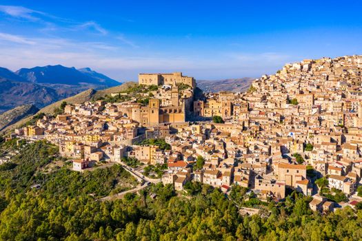 Caccamo, Sicily. Medieval Italian city with the Norman Castle in Sicily mountains, Italy. View of Caccamo town on the hill with mountains in the background, Sicily, Italy.